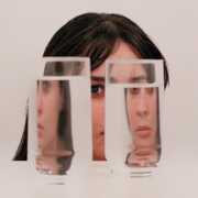 two clear drinking glasses with water