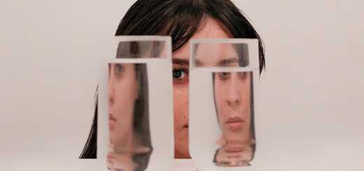 two clear drinking glasses with water