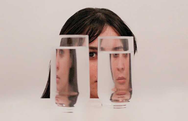 two clear drinking glasses with water